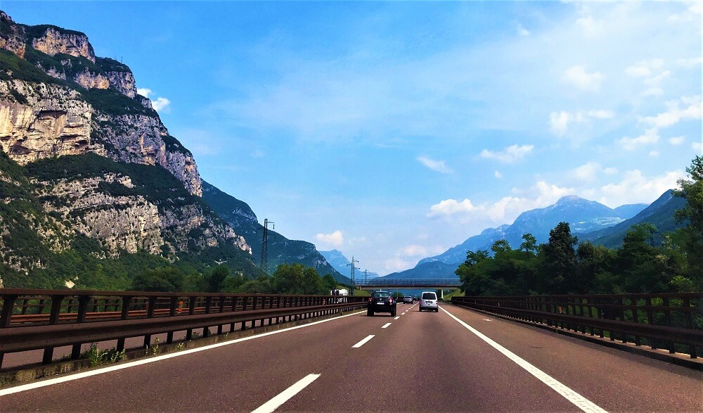 England to Italy by car: cars driving in the mountains