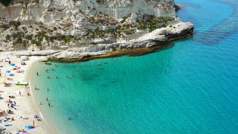 Turquoise sea and white cliffs at Tropea beach in Calabria