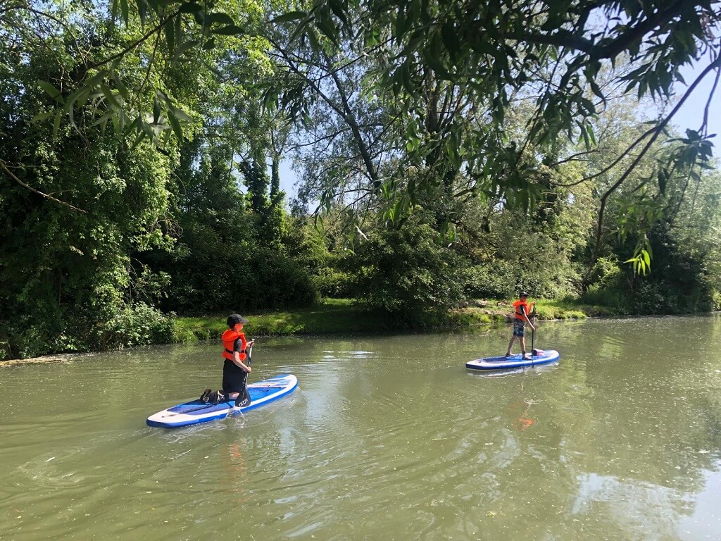 Paddle boarders on River Cam